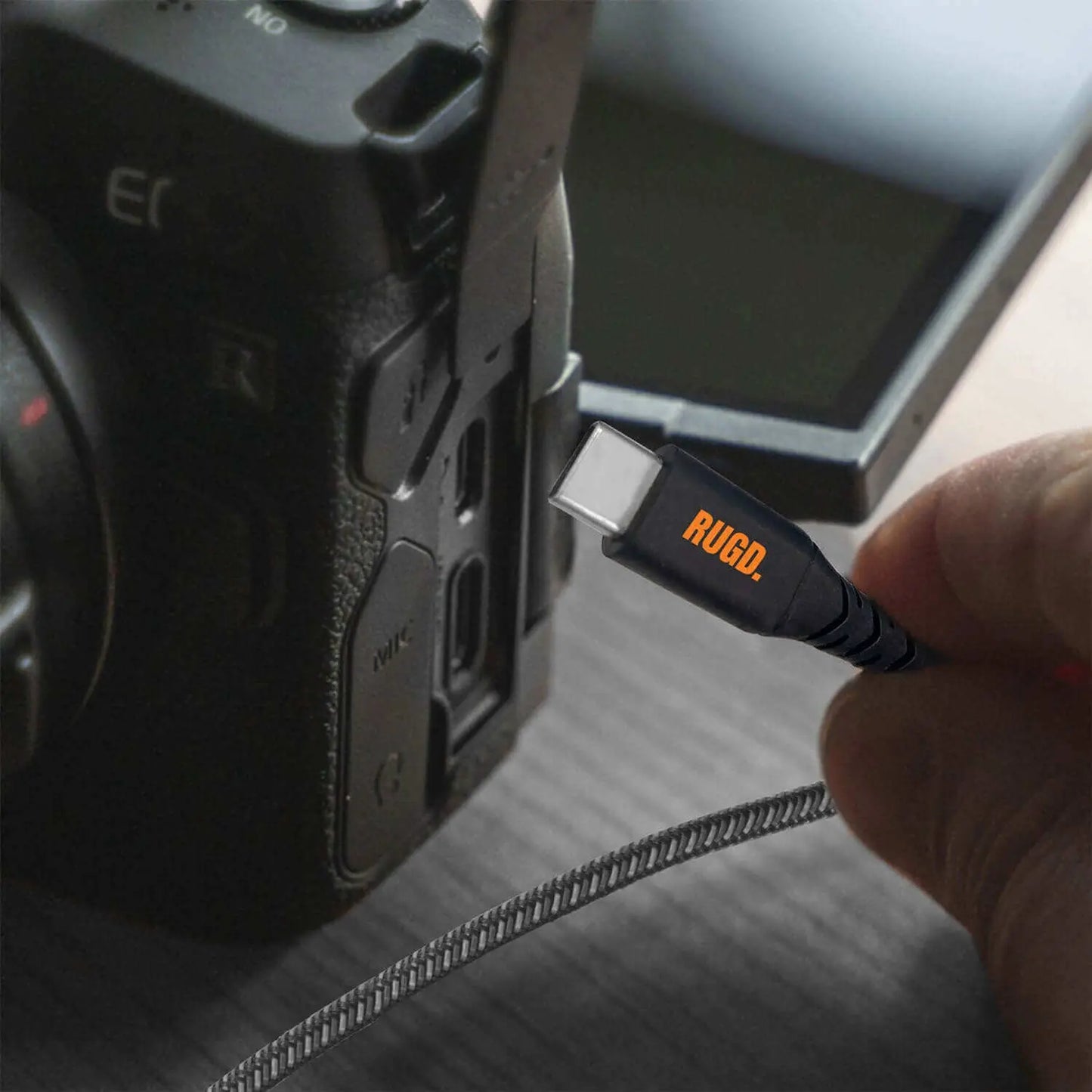 USB-C charging cable being connected to a digital camera for fast, reliable charging and data transfer.