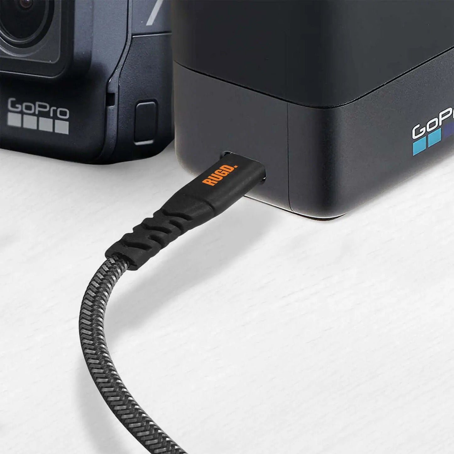 Rhino Power USB-C charging cable connected to a GoPro device.