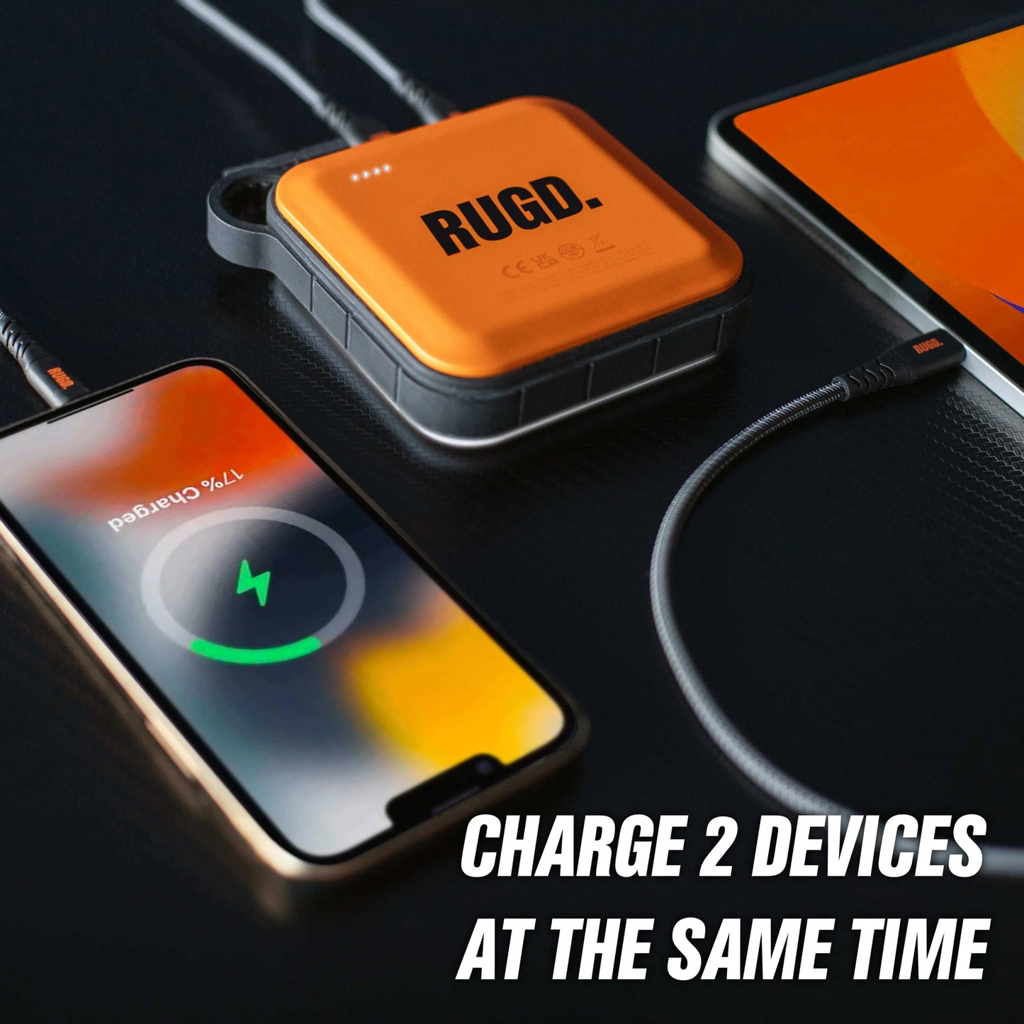 RUGD Power Brick charging two devices simultaneously, showcasing its camping power bank features.