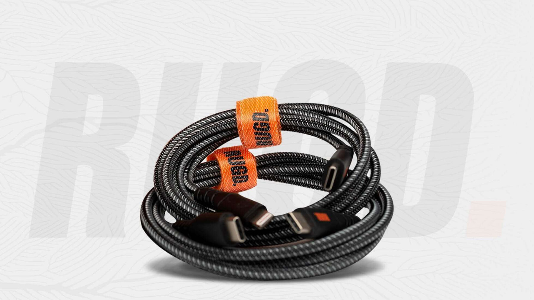 Coiled USB cables with orange cable organizers for effective cable management