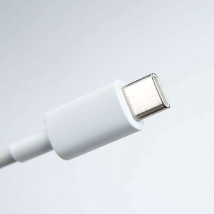 Close-up of a white USB-C cable for power delivery and data transfer.