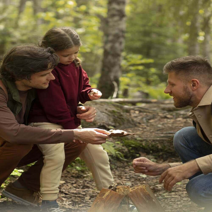 Family enjoying nature together while exploring a forest, engaging in outdoor activities to create unforgettable memories.