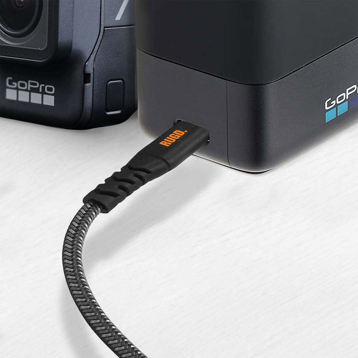 Rhino Power USB-C Charging Cable connected to GoPro camera, showcasing durable braided design.