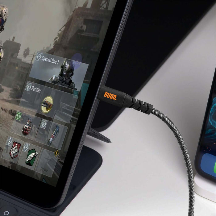 Rhino Power Lightning MFi to USB-C Charging Cable connected to a tablet playing an action game